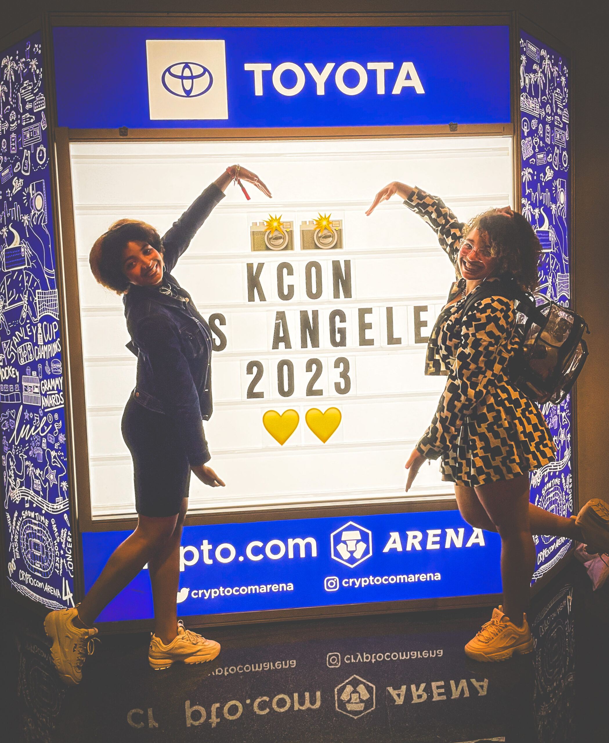 sisters at k-con LA in trendy coordinated outfits for a korean convention and k-pop concert